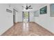 Basement with neutral tile flooring and French doors leading to the backyard pool at 312 Darst Ave, Punta Gorda, FL 33950
