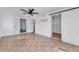 Basement with neutral tile flooring, a modern ceiling fan, and access to a storage closet at 312 Darst Ave, Punta Gorda, FL 33950