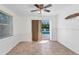 Bright dining room with sliding glass doors overlooking the pool and tiled floors at 312 Darst Ave, Punta Gorda, FL 33950