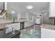 Modern kitchen with stainless steel appliances, white cabinets, and granite countertops at 312 Darst Ave, Punta Gorda, FL 33950
