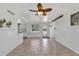 Open living space with tile flooring, ceiling fan, and easy access to the backyard at 312 Darst Ave, Punta Gorda, FL 33950