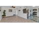 A spacious living room with tile flooring leads to the kitchen, with stainless steel appliances at 312 Darst Ave, Punta Gorda, FL 33950