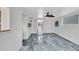 Bright living room with beautiful blue marble floors and a ceiling fan at 312 Darst Ave, Punta Gorda, FL 33950
