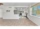 Open living space leading to a bright kitchen with stainless steel appliances at 312 Darst Ave, Punta Gorda, FL 33950