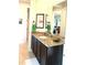 Bathroom featuring granite countertop, undermount sink and bronze fixtures at 3414 Sandpiper Dr, Punta Gorda, FL 33950