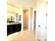 This bathroom features an elegant vanity with granite counters and a separate water closet at 3414 Sandpiper Dr, Punta Gorda, FL 33950