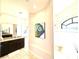 This bathroom features an elegant vanity with granite counters and a walk-in shower at 3414 Sandpiper Dr, Punta Gorda, FL 33950