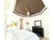 This bedroom features a decorative trey ceiling, a ceiling fan, and contemporary decor at 3414 Sandpiper Dr, Punta Gorda, FL 33950