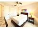 Bright bedroom featuring a ceiling fan and a comfortable queen-sized bed with neutral tones at 3414 Sandpiper Dr, Punta Gorda, FL 33950