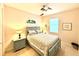 Serene bedroom with soft colors, a ceiling fan, and two bedside lamps creates a cozy and inviting atmosphere at 3414 Sandpiper Dr, Punta Gorda, FL 33950