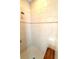 Shower featuring tiled walls and floor, along with a built-in bench at 3414 Sandpiper Dr, Punta Gorda, FL 33950