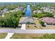This property is located on a canal and features mature landscaping at 4053 Joseph St, Port Charlotte, FL 33948
