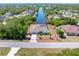 Aerial view of a beautiful home with a spacious lot, waterfront access, and a screened lanai at 4053 Joseph St, Port Charlotte, FL 33948