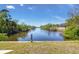 Serene backyard overlooking a picturesque canal, perfect for waterfront living at 4053 Joseph St, Port Charlotte, FL 33948