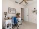 Cozy bedroom with a ceiling fan, desk, chair and decor at 4053 Joseph St, Port Charlotte, FL 33948