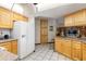 Spacious kitchen with ample cabinet space, granite countertops, and modern white appliances at 4053 Joseph St, Port Charlotte, FL 33948