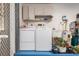 Functional laundry room with washer, dryer, and storage cabinets for efficient home management at 4053 Joseph St, Port Charlotte, FL 33948