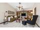 Cozy living room with ceiling fan, comfortable seating and built-in shelving at 4053 Joseph St, Port Charlotte, FL 33948