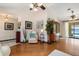 Spacious living area with hardwood floors, leading to a screened lanai overlooking the waterfront at 4053 Joseph St, Port Charlotte, FL 33948