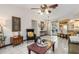 Bright living room with tile flooring and open concept kitchen and backyard access at 4053 Joseph St, Port Charlotte, FL 33948