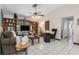 Living room with floor to ceiling shelves and seating with backyard view at 4053 Joseph St, Port Charlotte, FL 33948