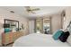 Main bedroom features outdoor views, a ceiling fan, and neutral carpeting, connecting to a relaxing outdoor area at 4053 Joseph St, Port Charlotte, FL 33948