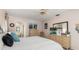 Comfortable main bedroom features a ceiling fan, dresser, and access to the bathroom at 4053 Joseph St, Port Charlotte, FL 33948