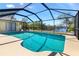 Sparkling screened-in pool offers privacy and relaxation with views of the waterway at 4053 Joseph St, Port Charlotte, FL 33948