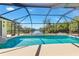 Inviting screened-in pool area with a view of the canal, perfect for relaxation and entertainment at 4053 Joseph St, Port Charlotte, FL 33948