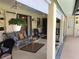 Relaxing porch featuring comfortable seating, stylish decor, and a view of the outdoors at 4053 Joseph St, Port Charlotte, FL 33948