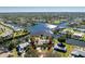 Expansive aerial view captures the home's prime location on a peninsula with a private pool at 4438 Meager Cir, Port Charlotte, FL 33948