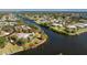 Breathtaking aerial view of a secluded home surrounded by waterways, features a private dock at 4438 Meager Cir, Port Charlotte, FL 33948