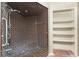 Bathroom featuring a unique tiled shower with built-in bench seating and open shelving at 4438 Meager Cir, Port Charlotte, FL 33948