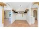 Walk-in closet featuring an open design with hanging rods and tile flooring at 4438 Meager Cir, Port Charlotte, FL 33948