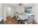 Cozy dining room featuring a large dining table and sliding glass doors to the pool area at 4438 Meager Cir, Port Charlotte, FL 33948