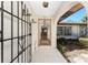 Open doorway showcases the tile flooring and interior layout, leading from the front entry into the house at 4438 Meager Cir, Port Charlotte, FL 33948