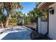 Elegant gated entrance with meticulously landscaped surroundings offers privacy and an inviting approach at 4438 Meager Cir, Port Charlotte, FL 33948