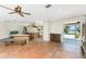 Spacious open concept living room with tile flooring and access to the pool, providing easy indoor/outdoor living at 4438 Meager Cir, Port Charlotte, FL 33948