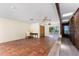 Bright and airy living space with a built-in wall and sliding glass doors to the outside at 4438 Meager Cir, Port Charlotte, FL 33948