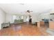 Spacious living room with tile floors, ceiling fan, and a large window providing natural light at 4438 Meager Cir, Port Charlotte, FL 33948