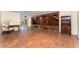 Open living space with unique wood and stone accents and easy access to the outdoor area at 4438 Meager Cir, Port Charlotte, FL 33948