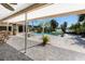 A covered patio boasts tranquil views of the pool and the surrounding waterway at 4438 Meager Cir, Port Charlotte, FL 33948