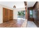 Covered patio area with sliding glass doors and wooden closet providing easy access to outdoor living at 4438 Meager Cir, Port Charlotte, FL 33948