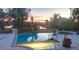 Outdoor pool with a spa, deck, and waterfront views perfect for relaxation or entertainment at 4438 Meager Cir, Port Charlotte, FL 33948