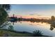 Beautiful sunset reflecting over a serene waterway and lush landscaping; the property offers stunning natural beauty at 4438 Meager Cir, Port Charlotte, FL 33948