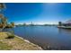 Waterfront views surrounded by a canal and lush greenery along the water on a bright sunny day at 4438 Meager Cir, Port Charlotte, FL 33948