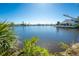 Picturesque waterfront view showcases serene canal and lush foliage, creating a tranquil residential setting at 4438 Meager Cir, Port Charlotte, FL 33948