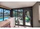 Screened patio with view of backyard and pool, includes a utility area and outdoor access at 509 Beal Nw St, Port Charlotte, FL 33952
