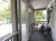 Charming porch with comfortable seating, decorative plants, and a relaxing outdoor ambiance at 523 Oliphant Ln, Punta Gorda, FL 33950