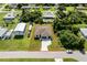 Aerial view of property featuring home with yard, shed, and driveway at 551 Crandall Nw St, Port Charlotte, FL 33952